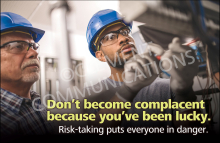 Safety banner designed to combat complacency and encourage continuous vigilance among all employees.