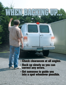 Safety poster titled "When Backing Up Your Vehicle" listing key safe driving steps: looking for obstacles in your path, checking clearances, moving slowly, and using mirrors.