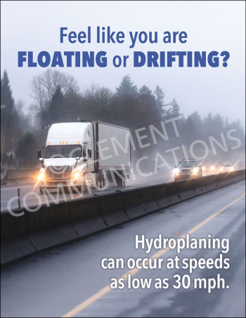 A safety poster showing a white semi-truck driving on a wet, foggy highway with its headlights on, featuring text warning that hydroplaning can occur at speeds as low as 30 mph.